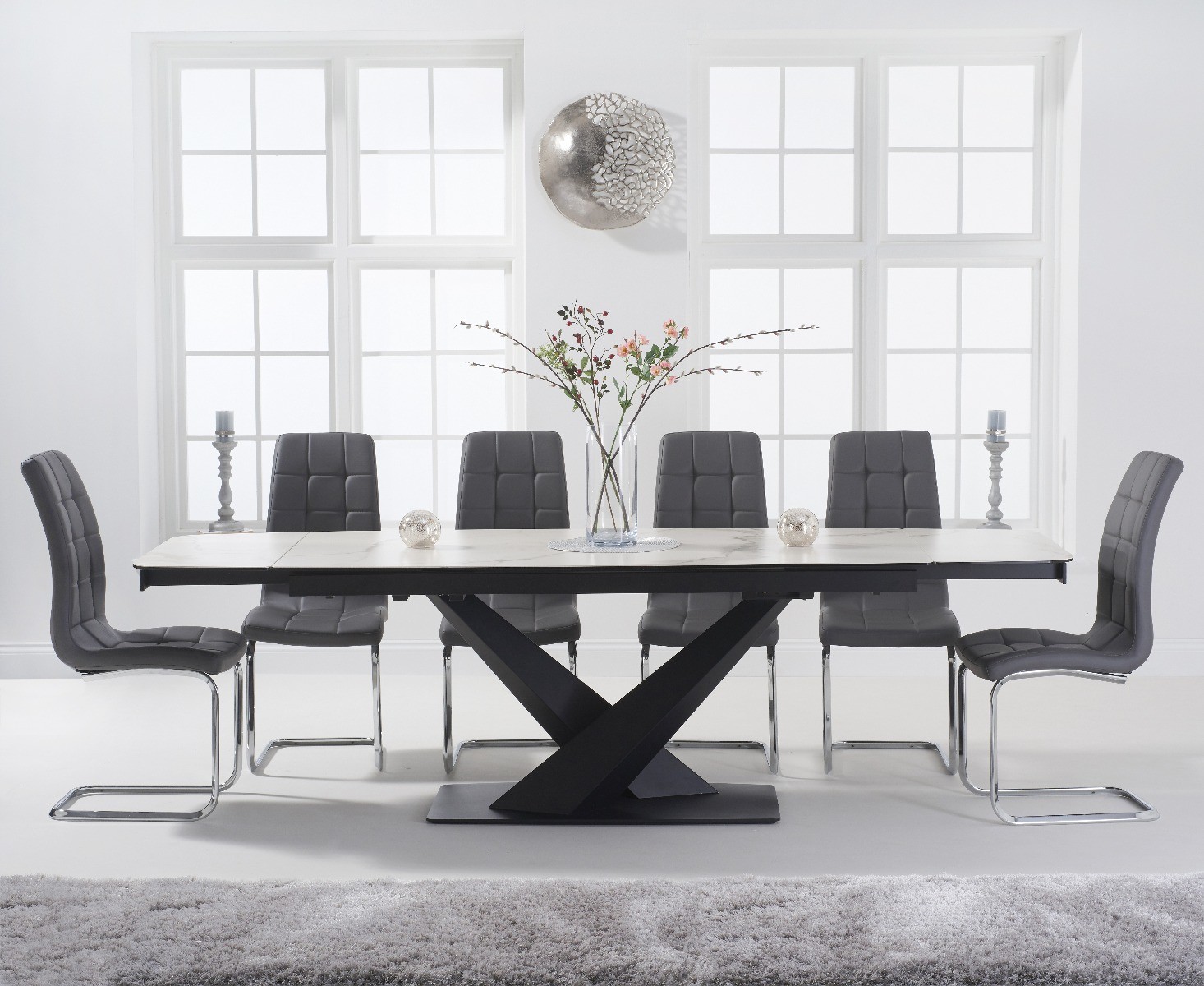 Product photograph of Extending Jacob 180cm White Ceramic Dining Table With 10 Black Vigo Chairs from Oak Furniture Superstore