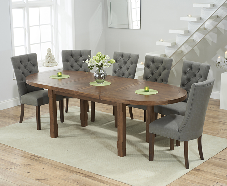 Product photograph of Caversham Dark Oak Extending Dining Table With 10 Cream Francois Fabric Dark Oak Leg Chairs from Oak Furniture Superstore.