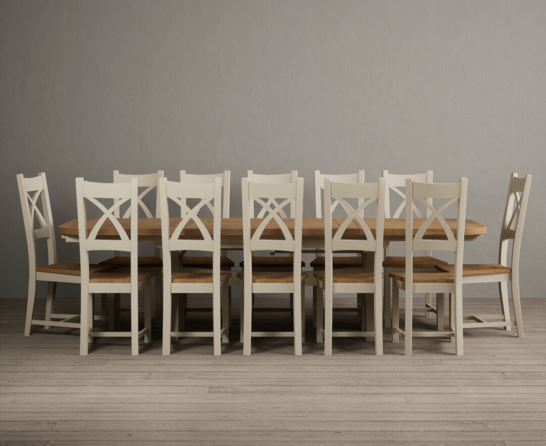 Photo 1 of Extending olympia 180cm oak and cream dining table with 10 brown x back chairs