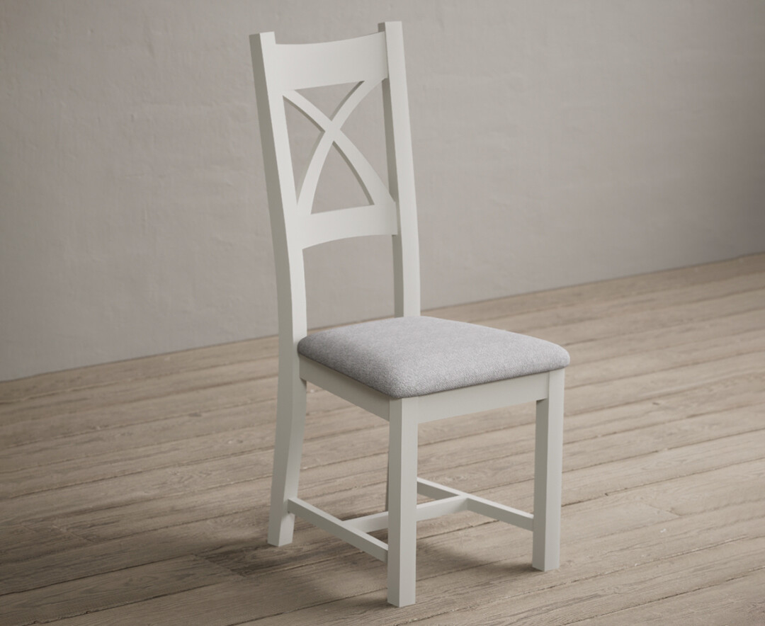Photo 1 of Painted signal white x back dining chairs with light grey fabric seat pad