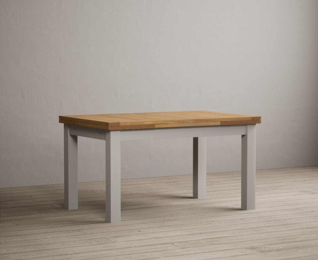 Product photograph of Extending Buxton 140cm Oak And Soft White Painted Dining Table from Oak Furniture Superstore