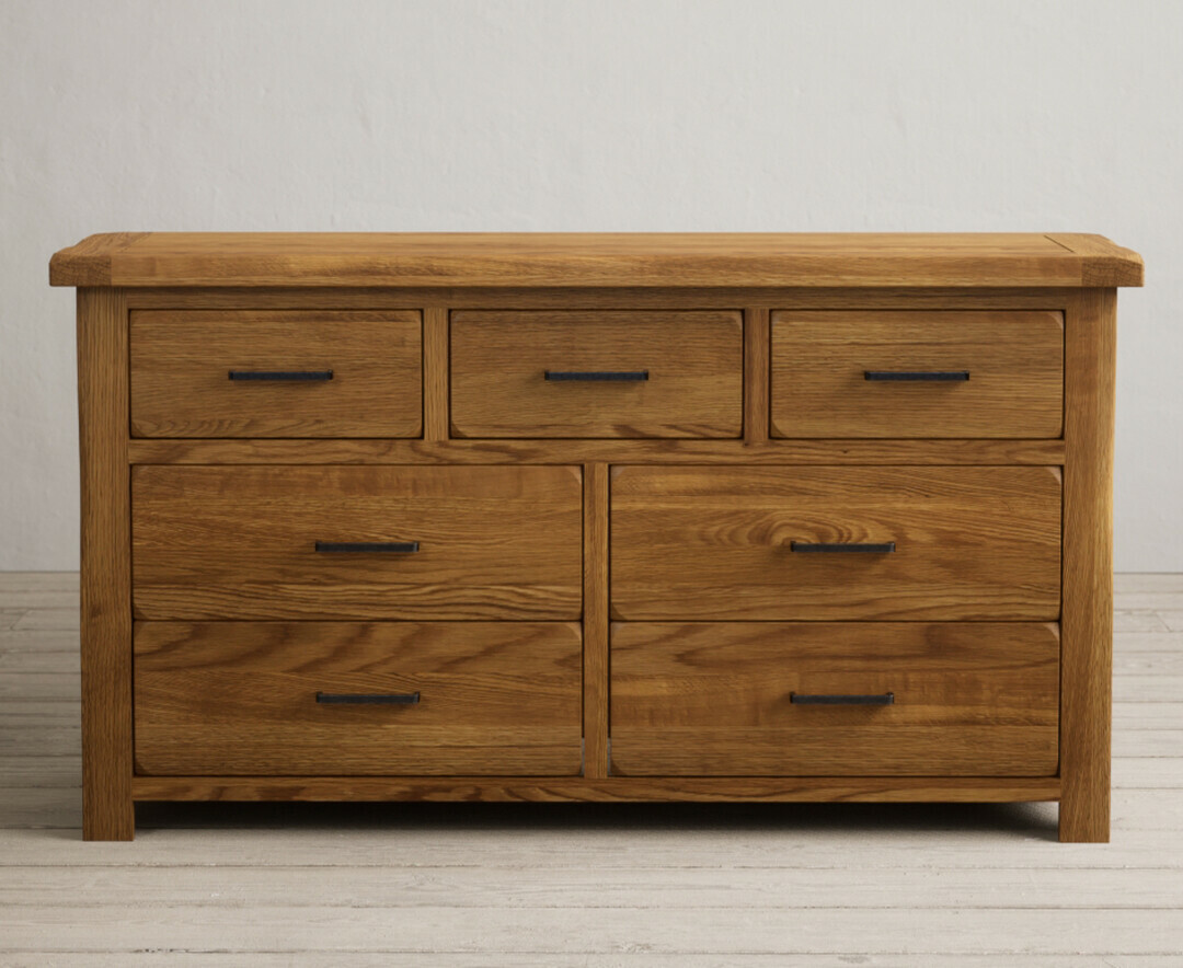 Product photograph of Harrogate Rustic Solid Oak Wide Chest Of Drawers from Oak Furniture Superstore