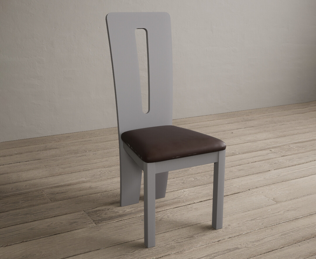 Photo 1 of Lucca light grey dining chairs with brown suede seat pad