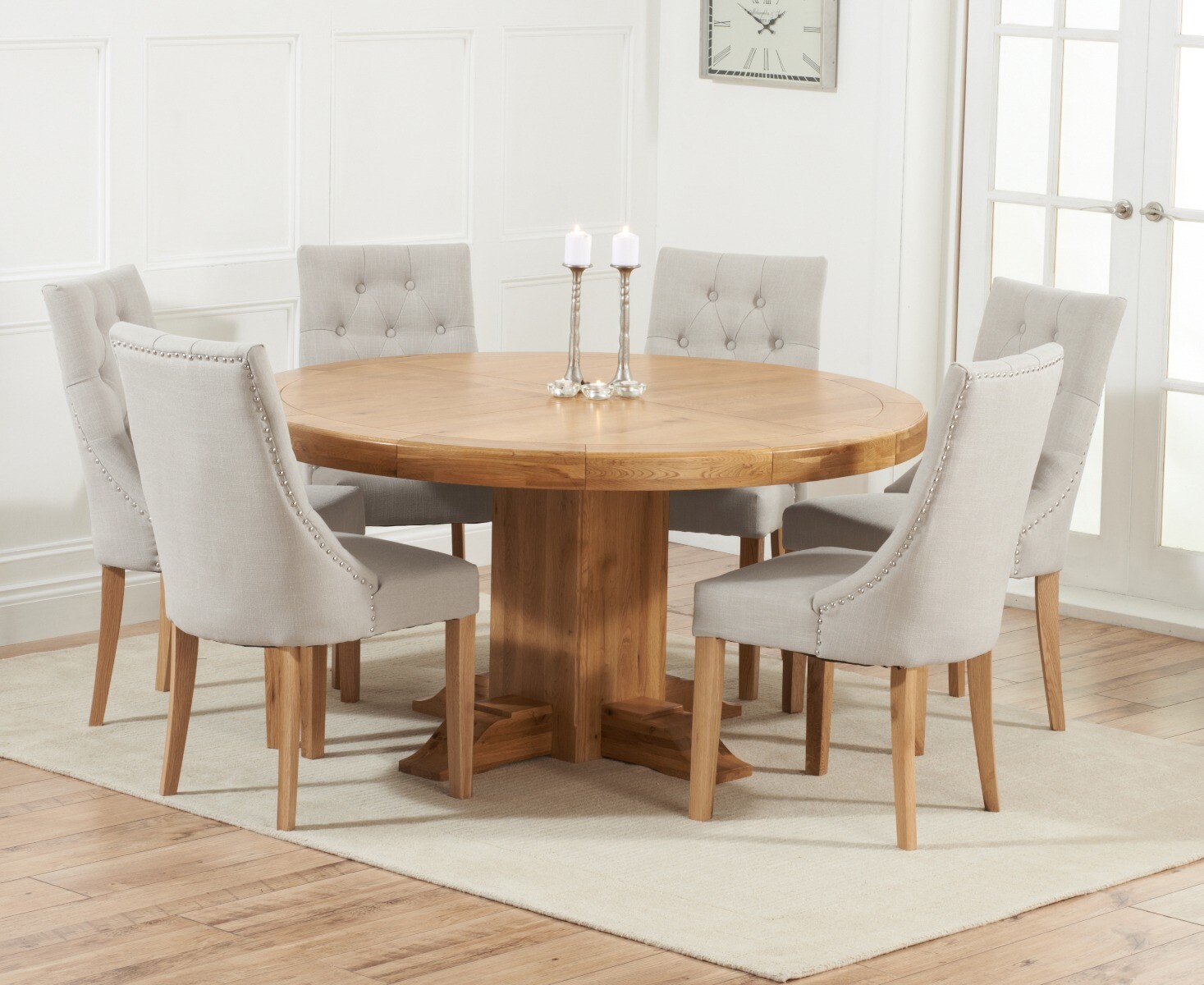 Product photograph of Helmsley 150cm Solid Oak Round Pedestal Dining Table With 8 Natural Beatrix Fabric Chairs from Oak Furniture Superstore