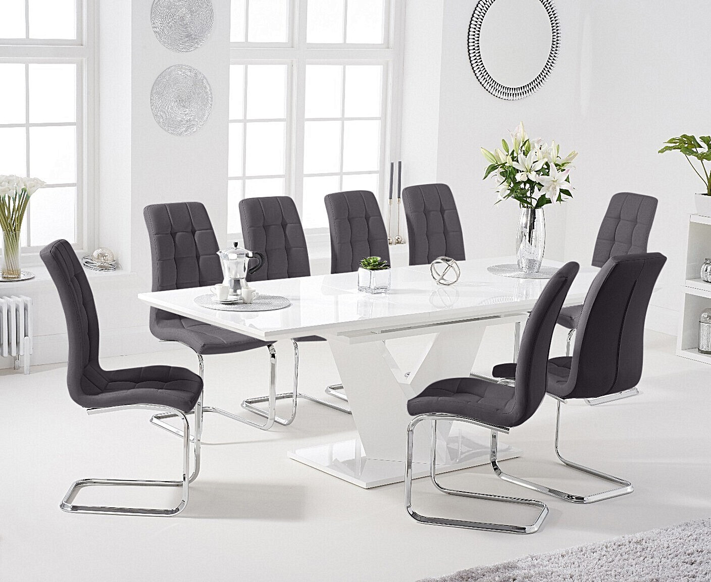 Photo 2 of Extending vittorio 160cm white high gloss dining table with 8 black vigo chairs