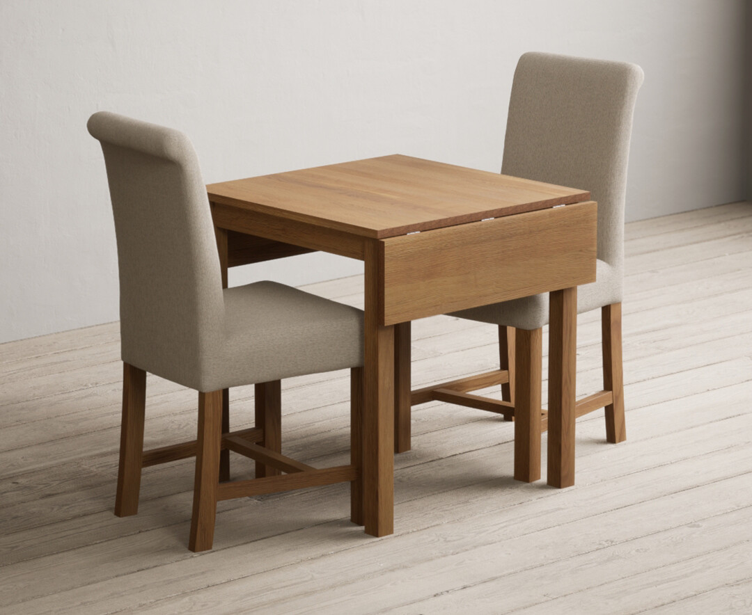 Photo 2 of Extending york 70cm solid oak drop leaf dining table with 2 charcoal grey chairs