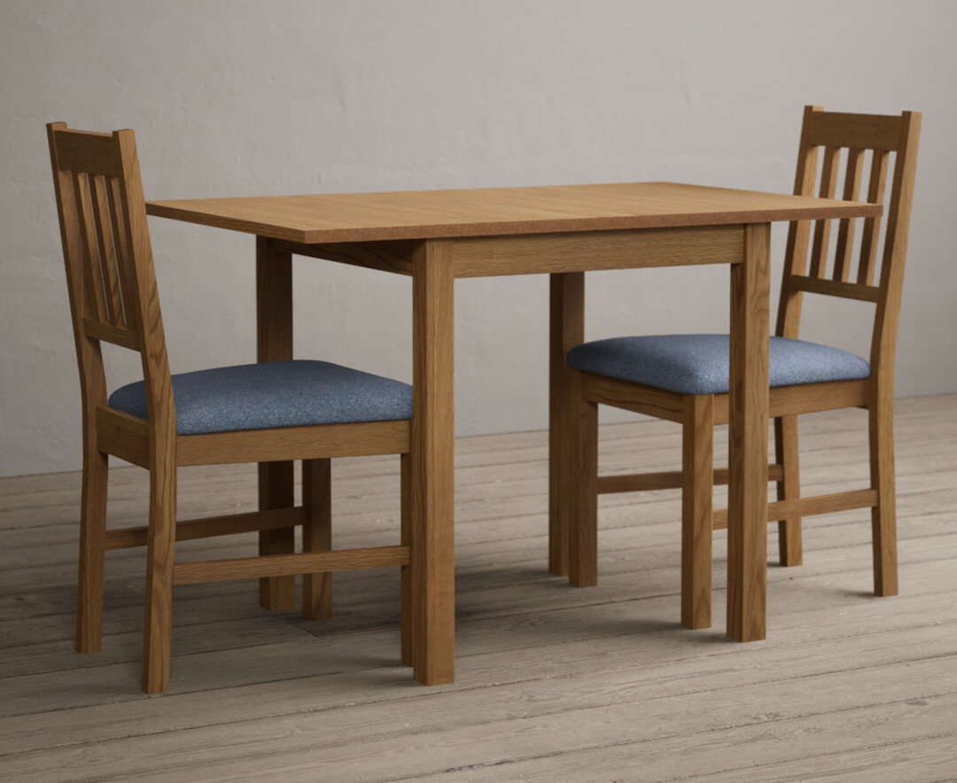 Photo 3 of Extending york 70cm solid oak drop leaf dining table with 4 linen chairs